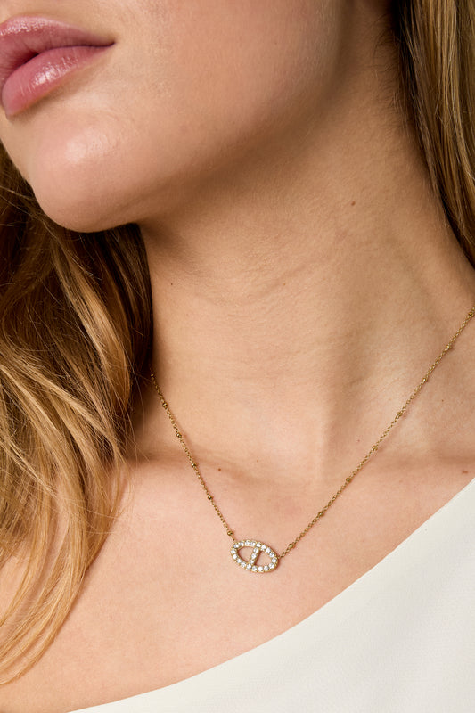 Necklace with decorated oval pendant